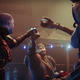 A Guardian, Drifter, and Eido raise glasses to one another.